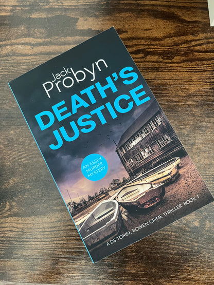 Book cover of Death's Justice, an Essex Murder Mystery by Jack Probyn. A gritty crime thriller featuring a weathered wooden boathouse on a muddy Essex shoreline at dusk. Book 1 in the DS Tomek Bowen series, perfect for fans of JD Kirk and JM Dalgliesh